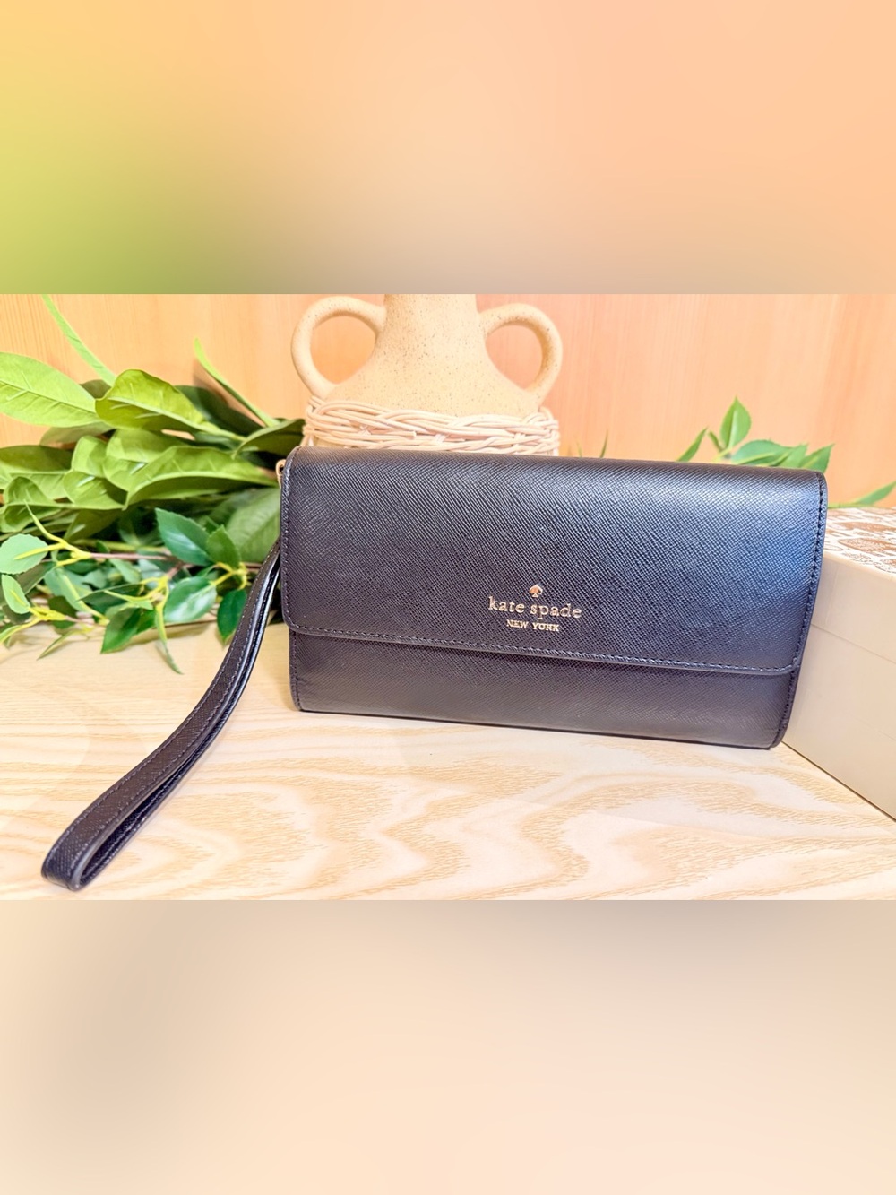 kate spade black saffiano leather wristlet clutch with gold logo